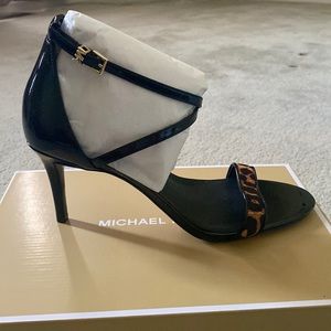 Brand new “Ava Mid Sandal” with black with animal print.The heel is 3 inches.